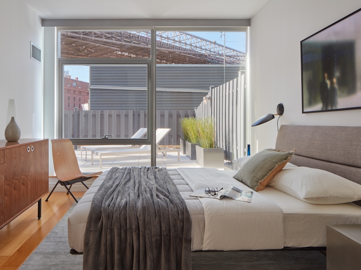 a living room filled with furniture and a large window