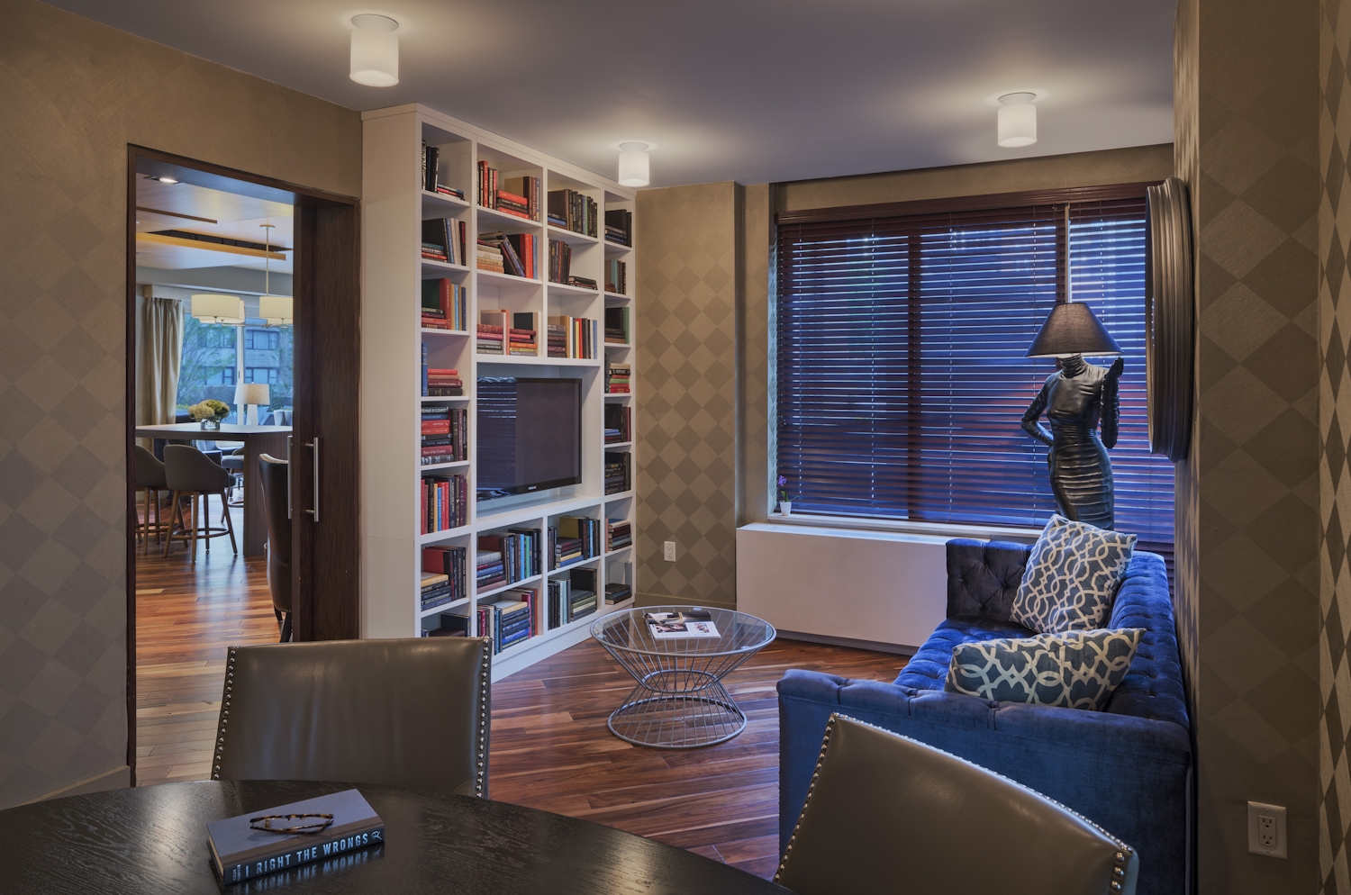 a living room filled with furniture and a large window