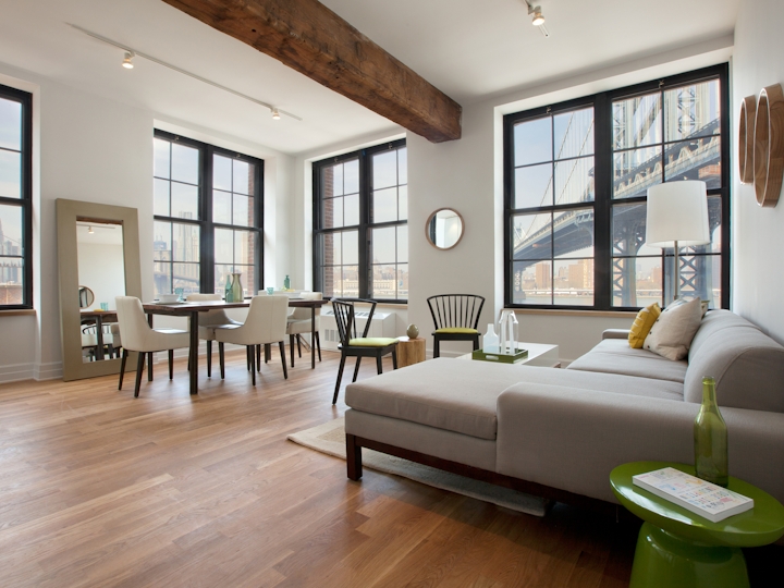a living room filled with furniture and a large window