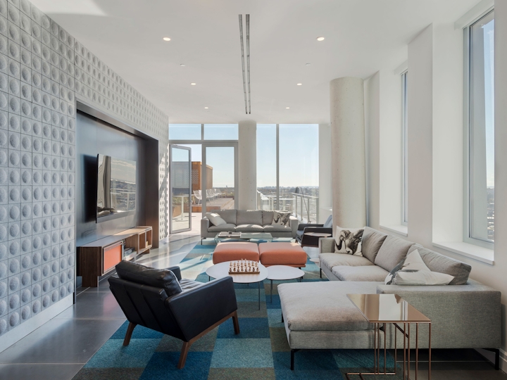 a living room filled with furniture and a large window