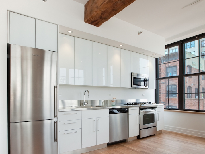 a kitchen with a wood floor