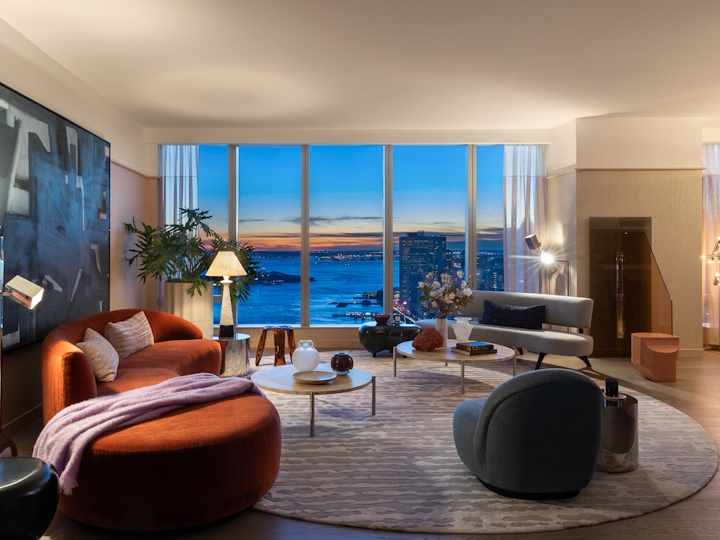 a living room filled with furniture and a large window
