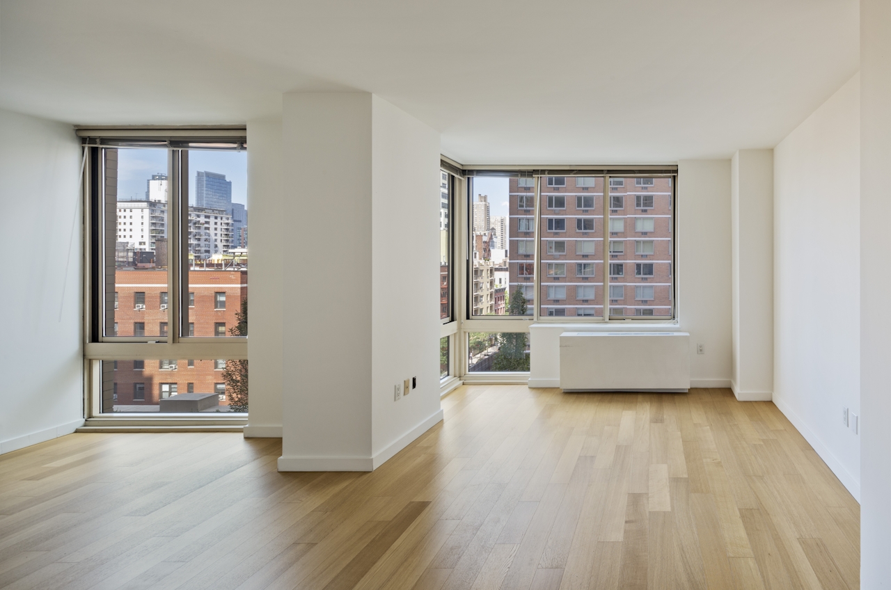 a room filled with furniture and a large window