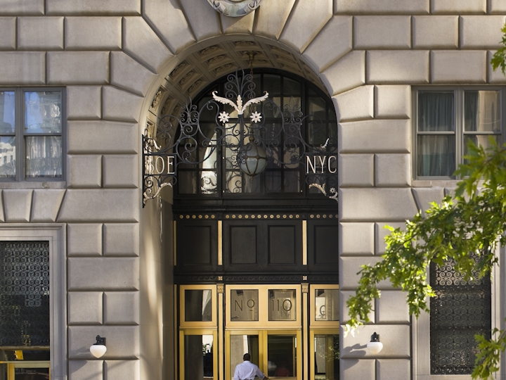 a large clock mounted to the side of a building