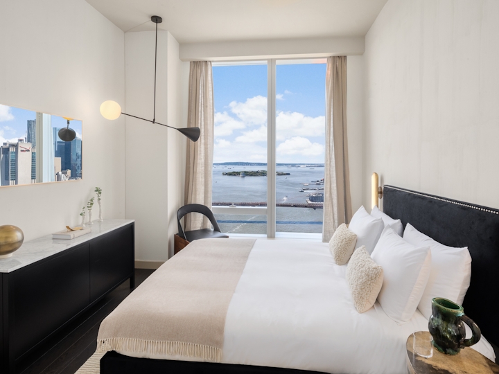 a hotel room with a bed and a window