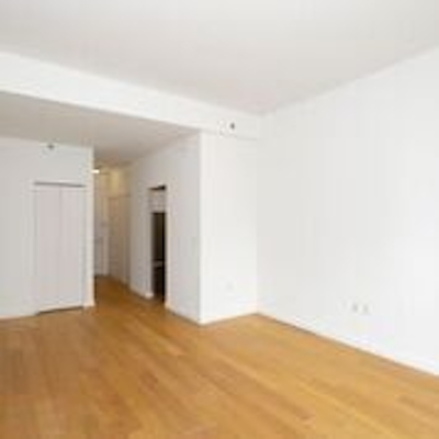 a large empty room with a hard wood floor