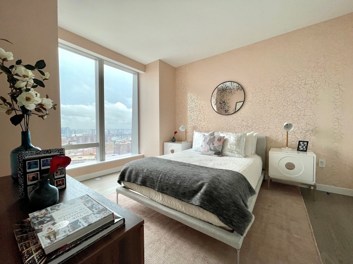 a living room filled with furniture and a large window