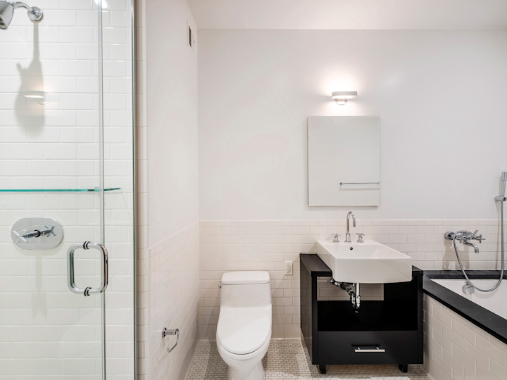 a room with a sink and a mirror