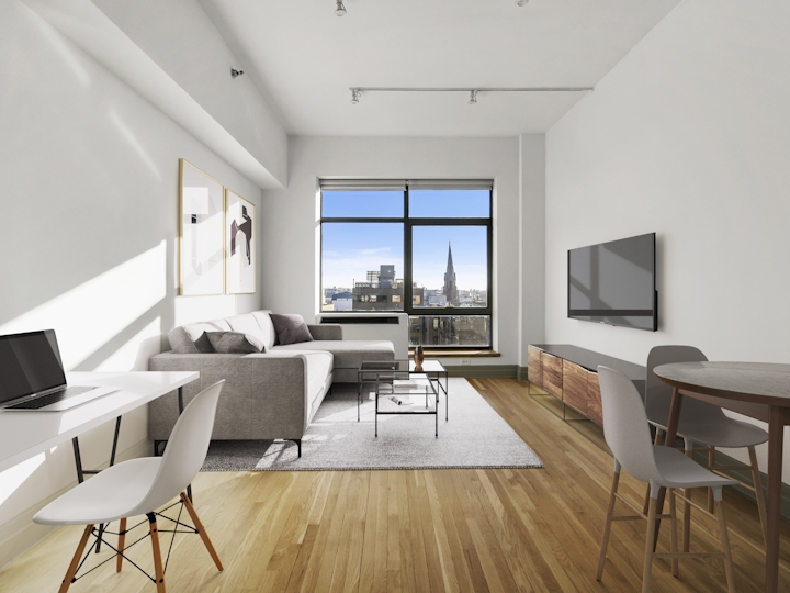 a living room filled with furniture and a large window