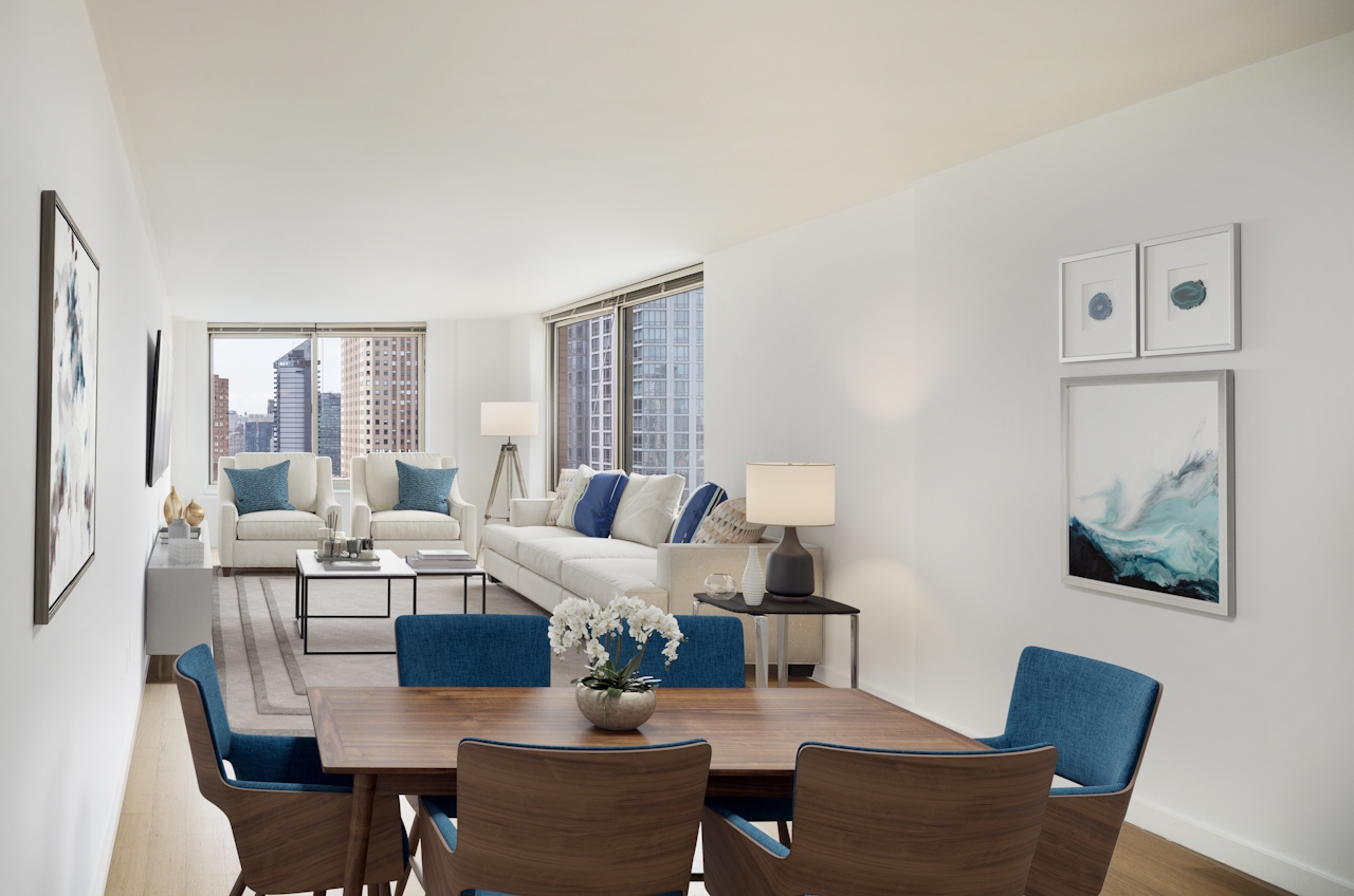 a living room filled with furniture and a window