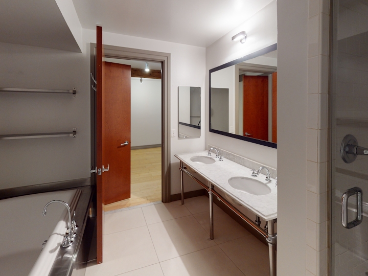 a room with a sink and a mirror