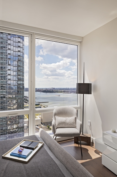 a bedroom with a large window