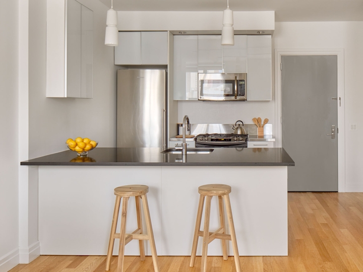 a kitchen with a table in a room
