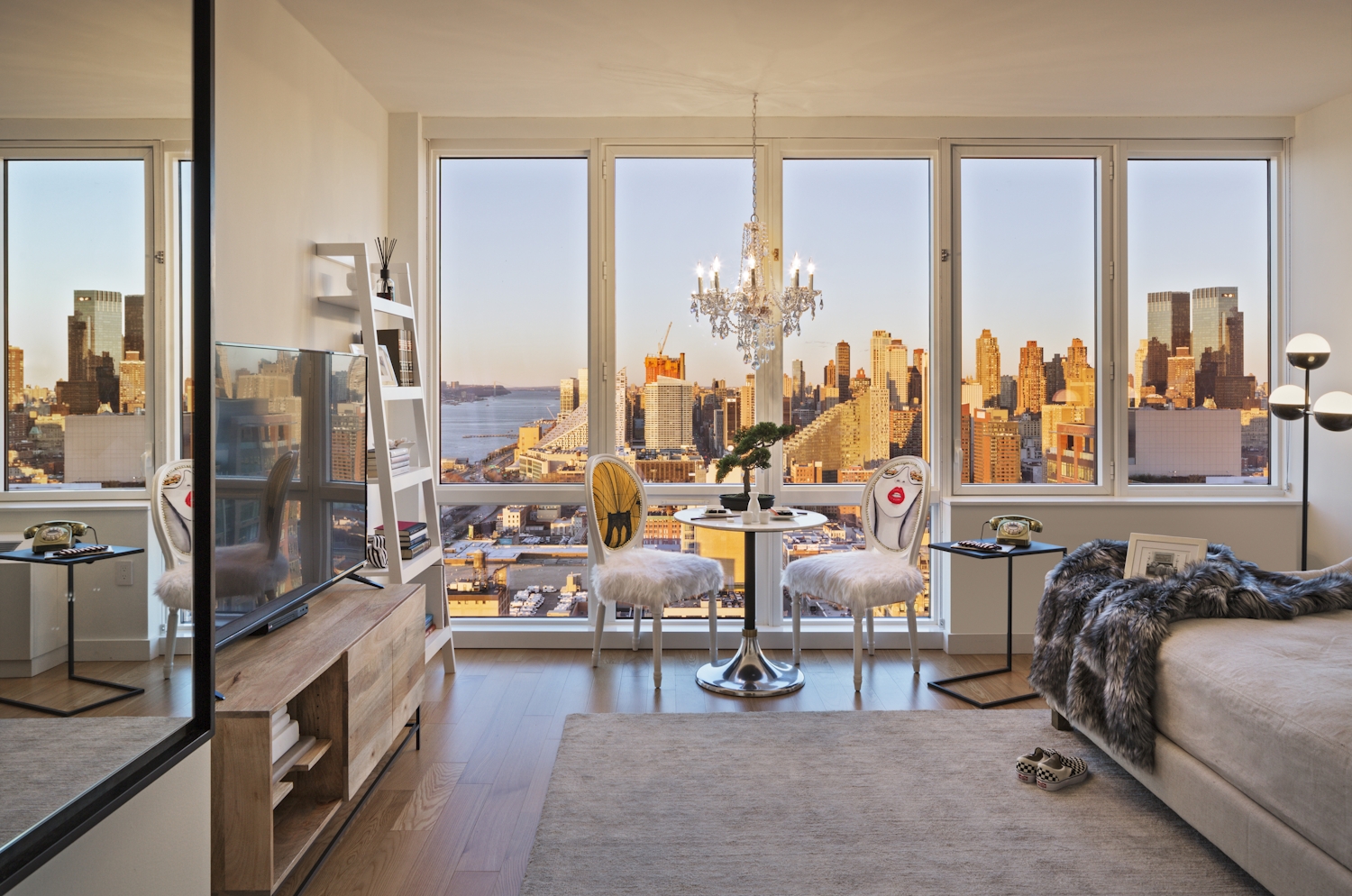 a room filled with furniture and a large window