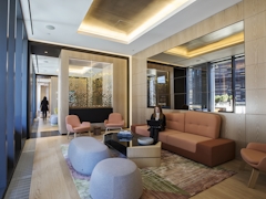 Thumbnail of The Ashland: 38K a living room filled with furniture and a large window