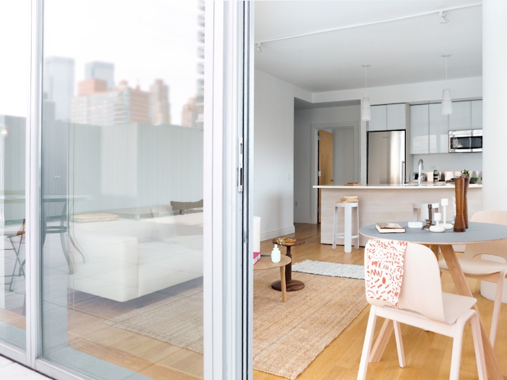 a dining room table in front of a window