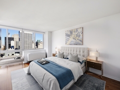 Thumbnail of Atlas New York: 44C a bedroom with a large bed in a room