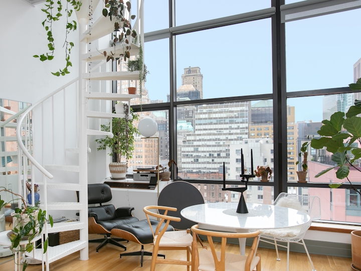a dining room table in front of a window