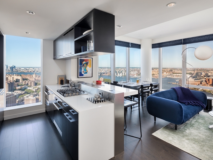 a modern kitchen with an island in the middle of a room