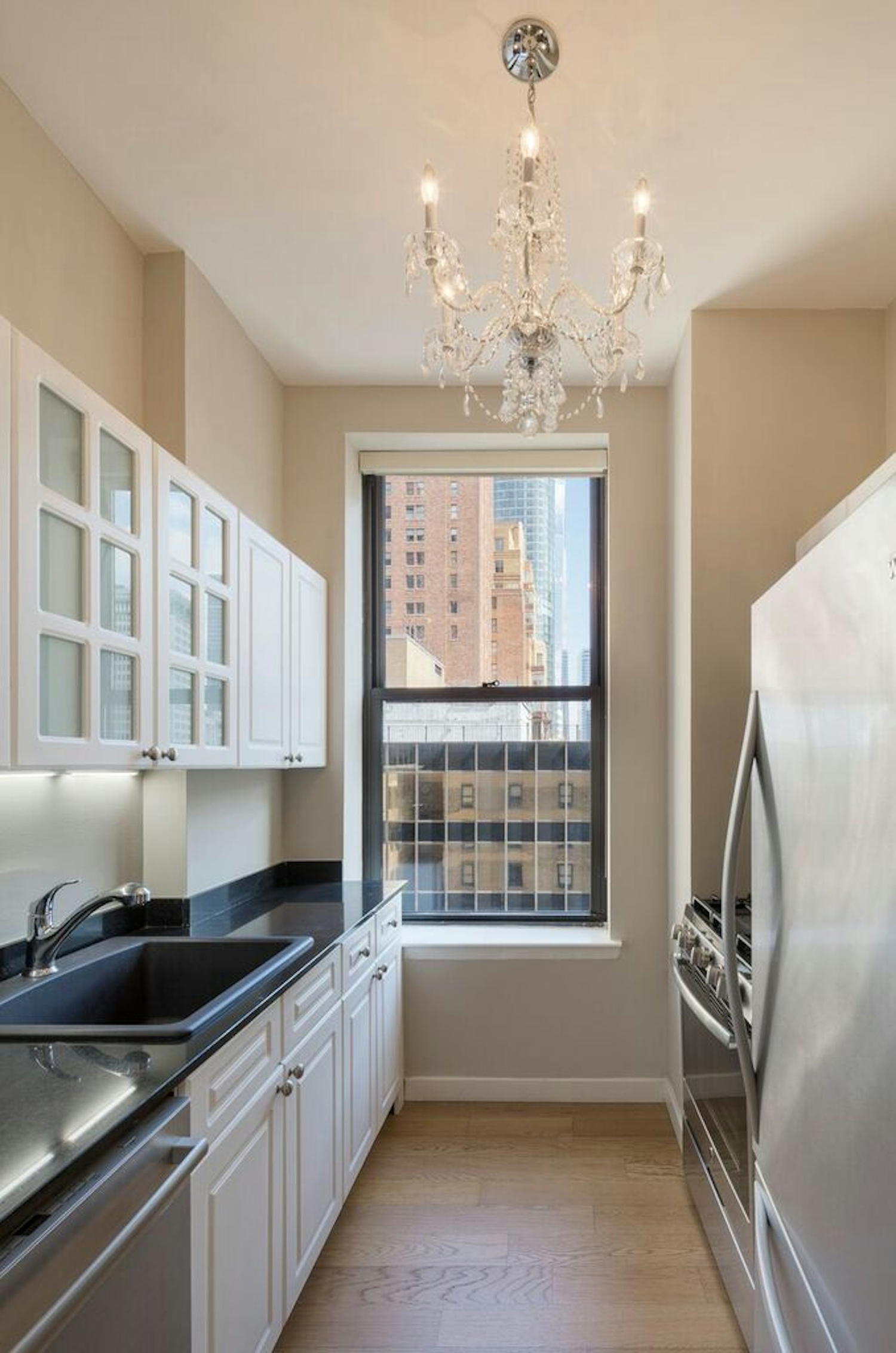 a kitchen with a sink and a window
