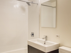 Thumbnail of Atlas New York: 22D a white sink sitting under a mirror