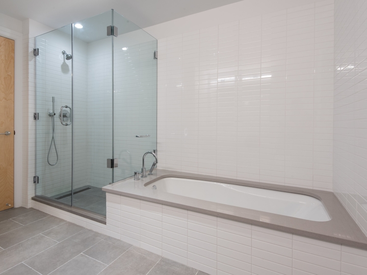 a room with a sink and a shower