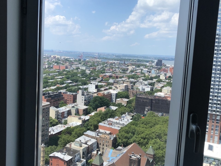 a view of a city next to a window