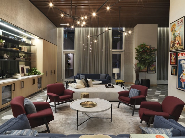 a living room filled with furniture and a large window