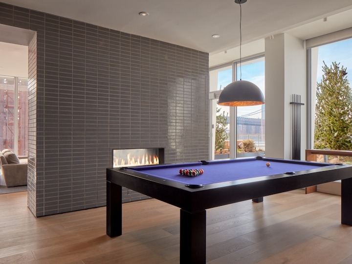 a living room filled with furniture and a large window