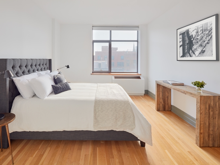 a living room filled with furniture and a large window