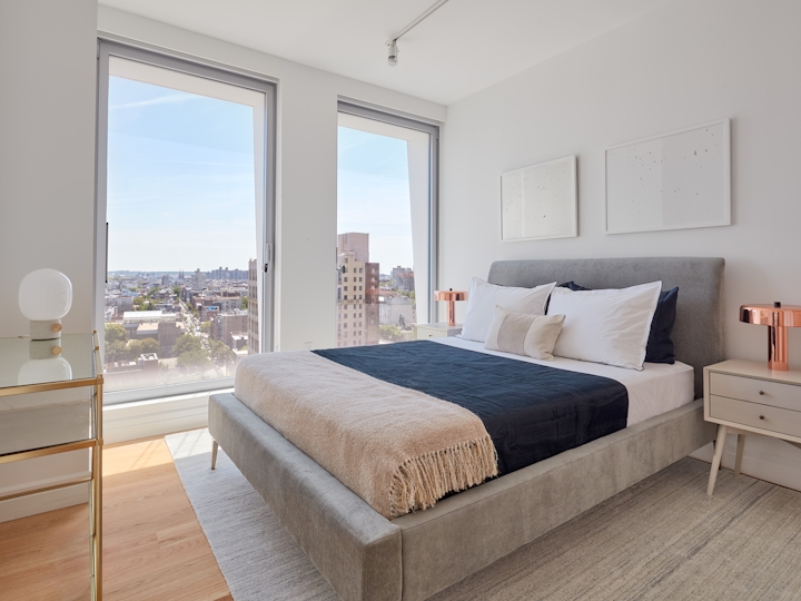 a bedroom with a large bed in a hotel room