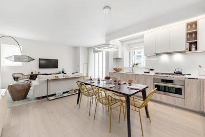 a kitchen with a dining room table