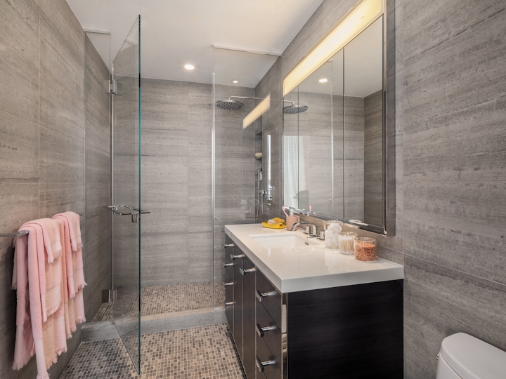 a room with a sink and a shower
