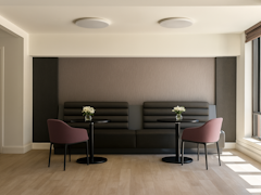 Thumbnail of The Nicole: 11D a room filled with furniture and a lamp