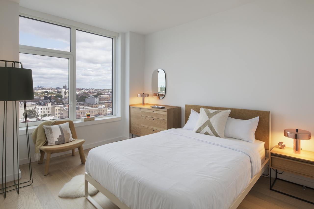 a bedroom with a large bed in a hotel room