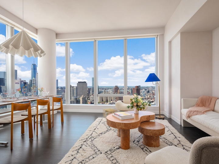 a living room filled with furniture and a large window