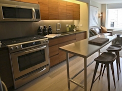 Thumbnail of Gotham West: 418 a stove top oven sitting inside of a kitchen