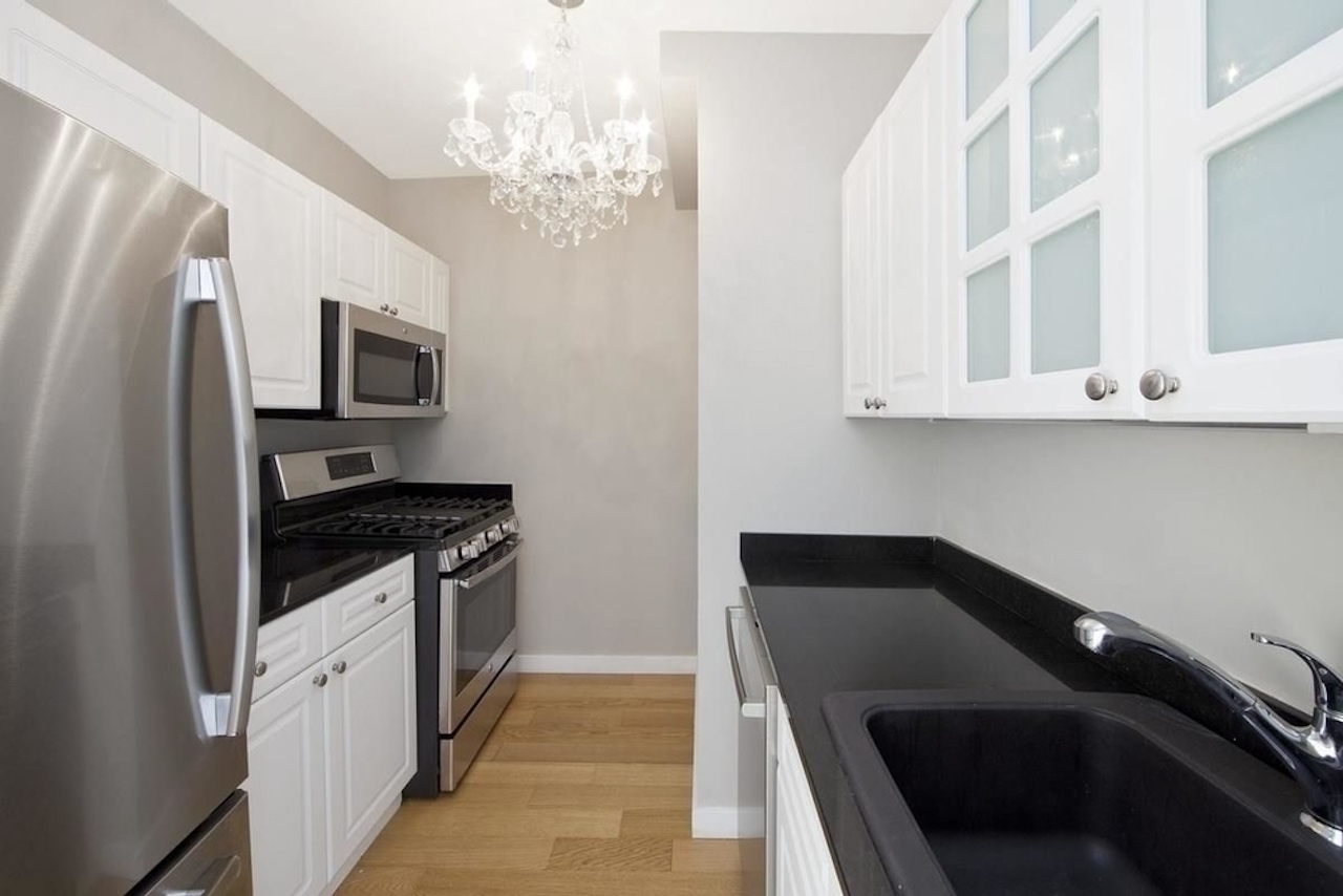 a modern kitchen with stainless steel appliances