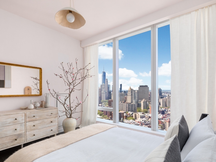 a bedroom with a large window
