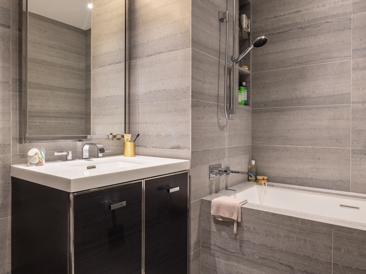 a room with a sink and a mirror