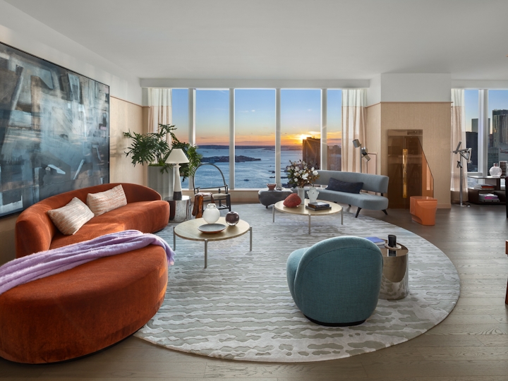 a living room filled with furniture and a large window
