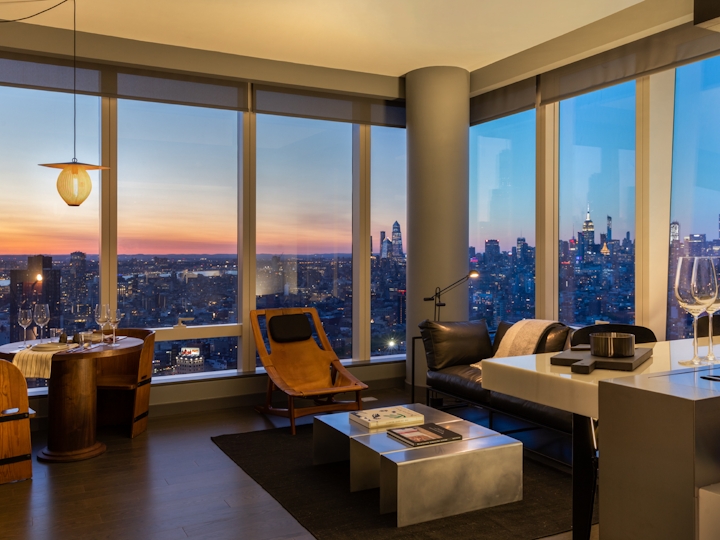 a room filled with furniture and a large window