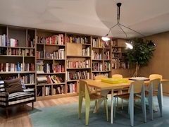 Thumbnail of Atlas New York: 39D a room filled with furniture and a book shelf