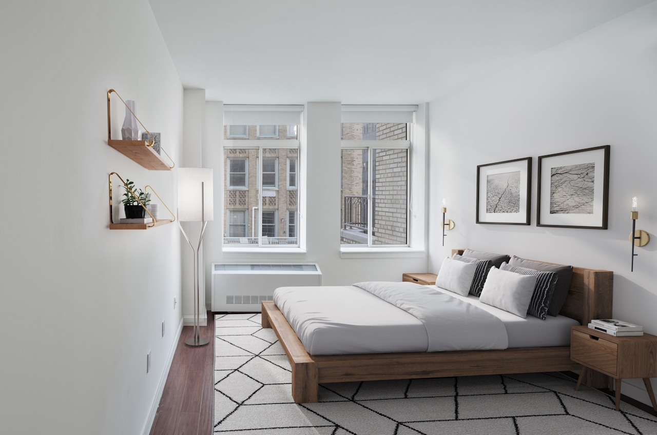 a living room with a bed and a window