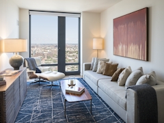 Thumbnail of The Ashland: 38N a living room filled with furniture and a large window