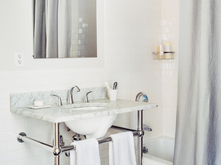 a room with a sink and a shower
