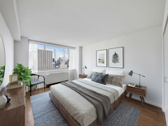 Thumbnail of Atlas New York: 10H a bedroom with a bed and desk in a room