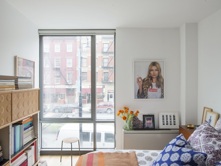 a living room filled with furniture and a large window