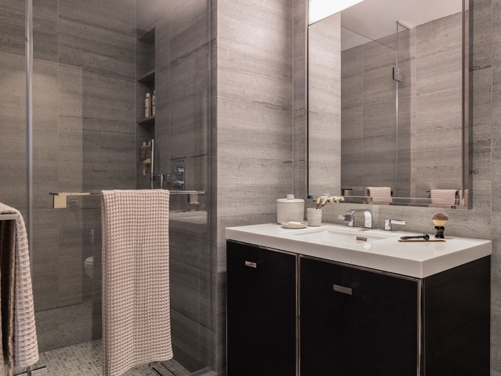 a room with a sink and a mirror
