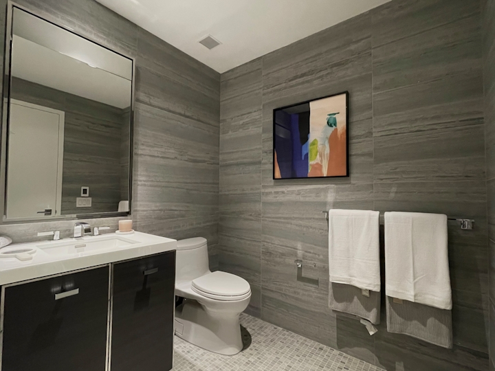 a room with a sink and a mirror